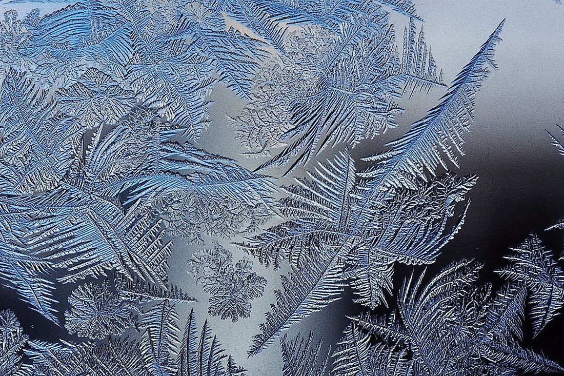 Frost crystals occurring naturally on cold glass